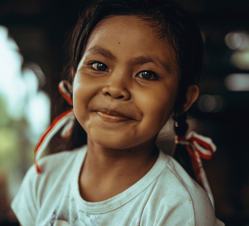 beautiful indonesian child girl with pigtails and ribbons. Beaut